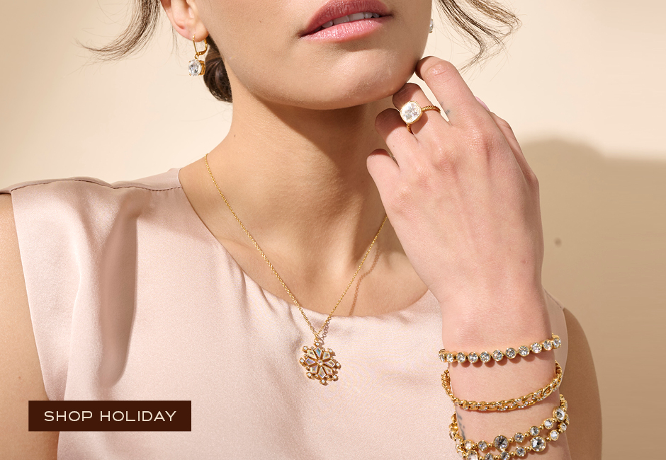 Woman wearing holiday inspired Golden Snowflake Necklace