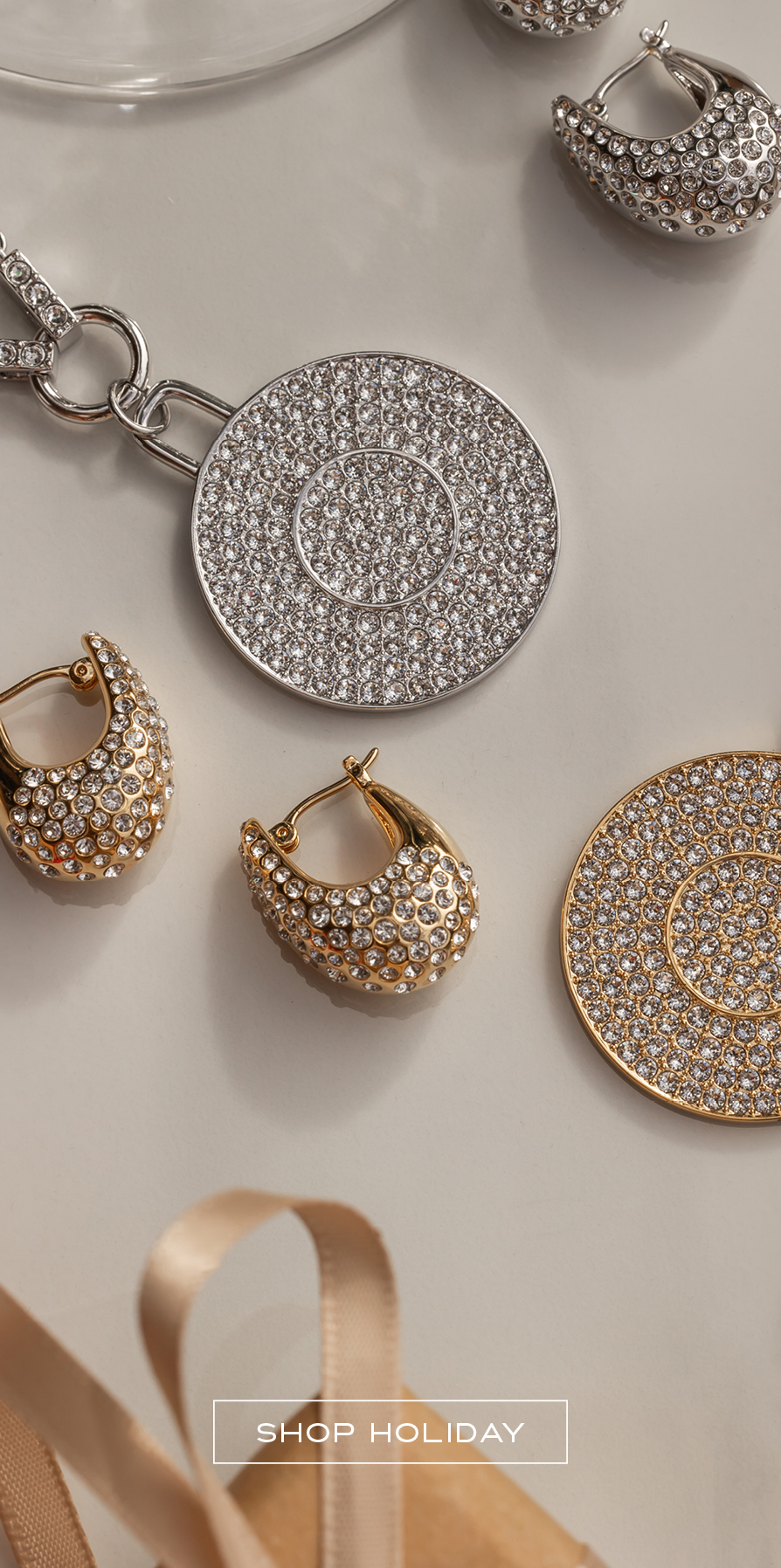Flatlay of Golden and Rhodium crystal jewelry for holiday gifts